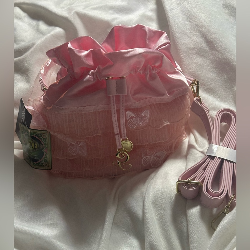 Glinda pullstring crossbody bag